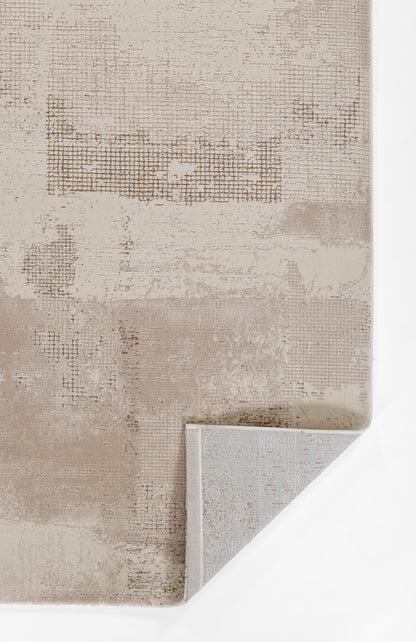 Beige abstract patterned rug with distressed grid patches & soft pile; light gray backing peeks at corner.