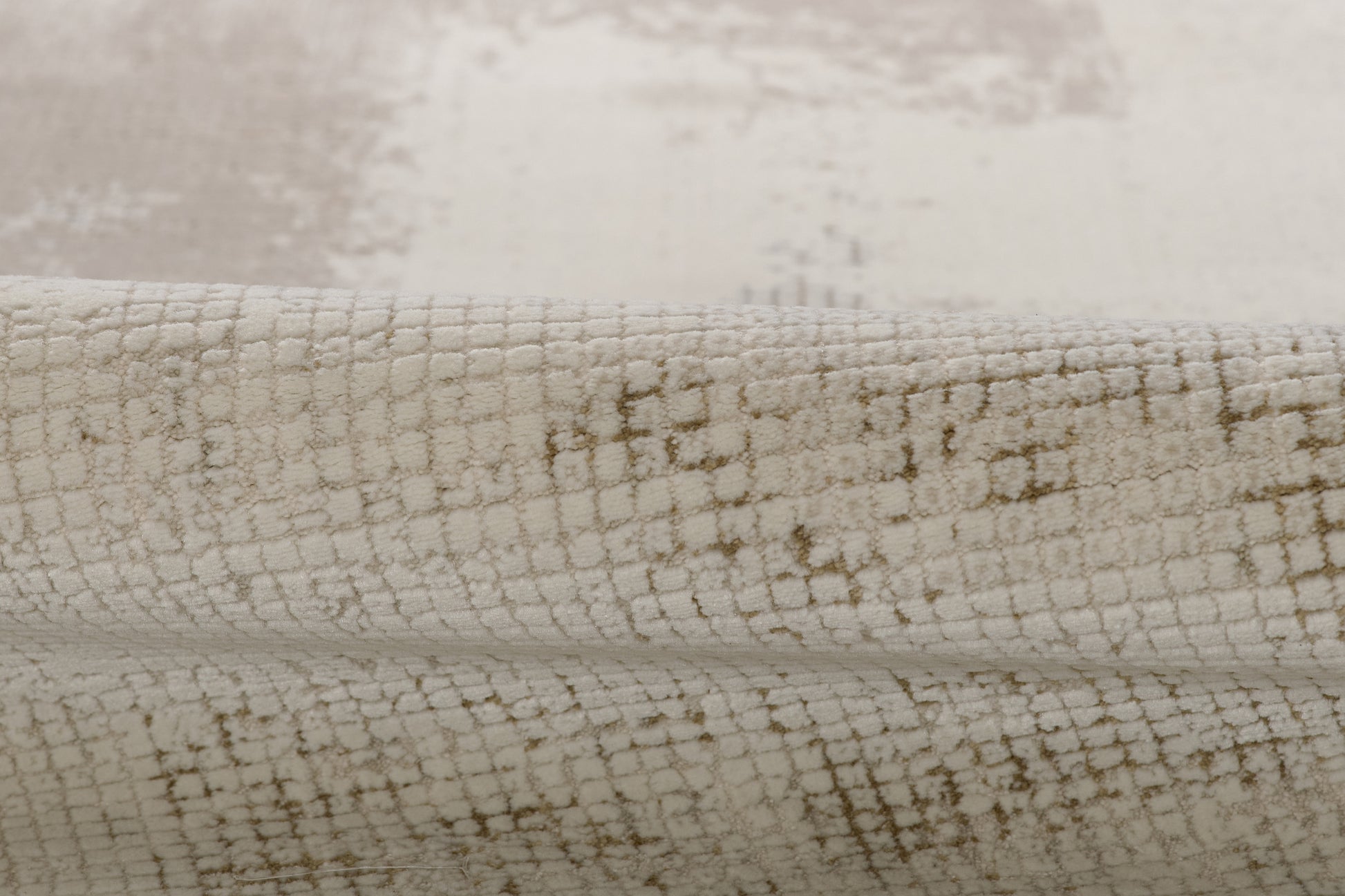 Ivory textured area rug with subtle taupe grid pattern and plush, soft pile.