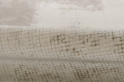 Cream ivory rug with taupe crackle grid pattern; soft woven, low-pile, rolled-edge rug.