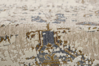 Beige distressed woven rug with blue-gray and tan motifs; vintage oriental area rug.