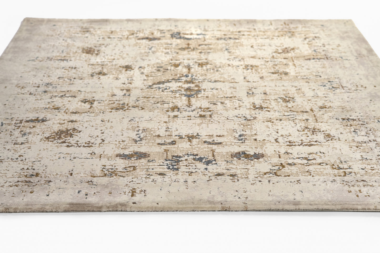 Beige distressed area rug with abstract faded blue & brown pattern, vintage-inspired low-pile design.