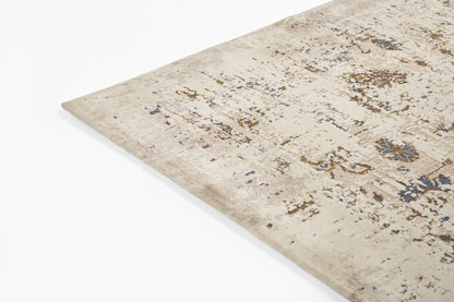 Beige distressed oriental rug with blue and brown accents; rectangular corner visible and plush texture.