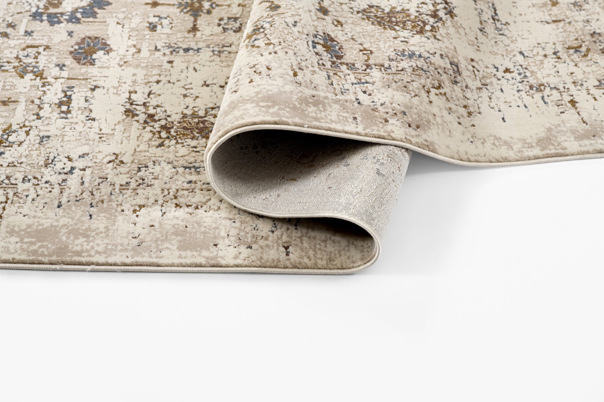 Beige distressed oriental runner rug with blue and brown motifs; rolled edge reveals soft beige underside.
