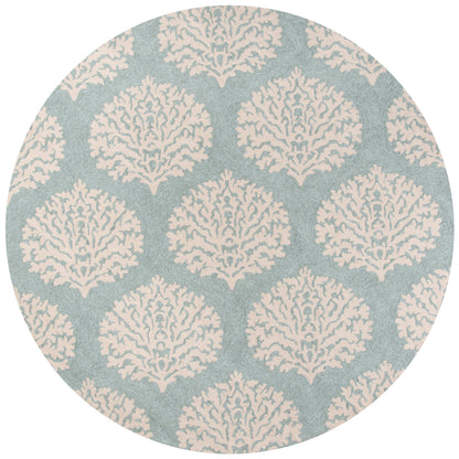 Round rug with ivory damask coral motifs on blue-gray background; elegant decorative pattern.