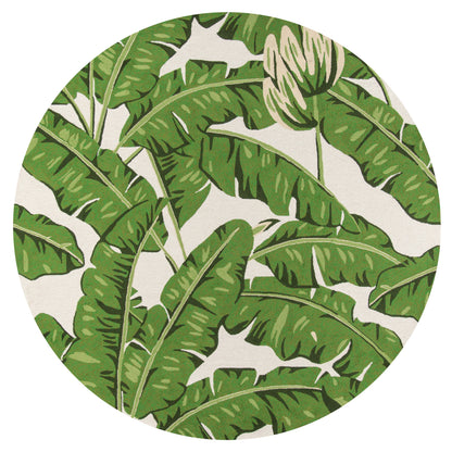 Circular tropical print rug featuring overlapping green banana leaves on a beige backdrop, lush botanical style.