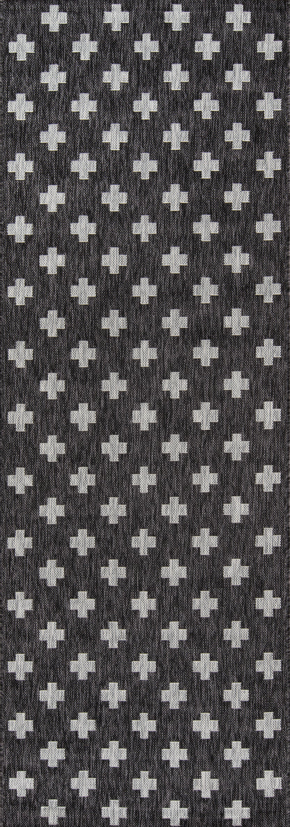 Charcoal knit fabric with a repeating light-gray cross motif; textured geometric pattern for apparel or home decor.
