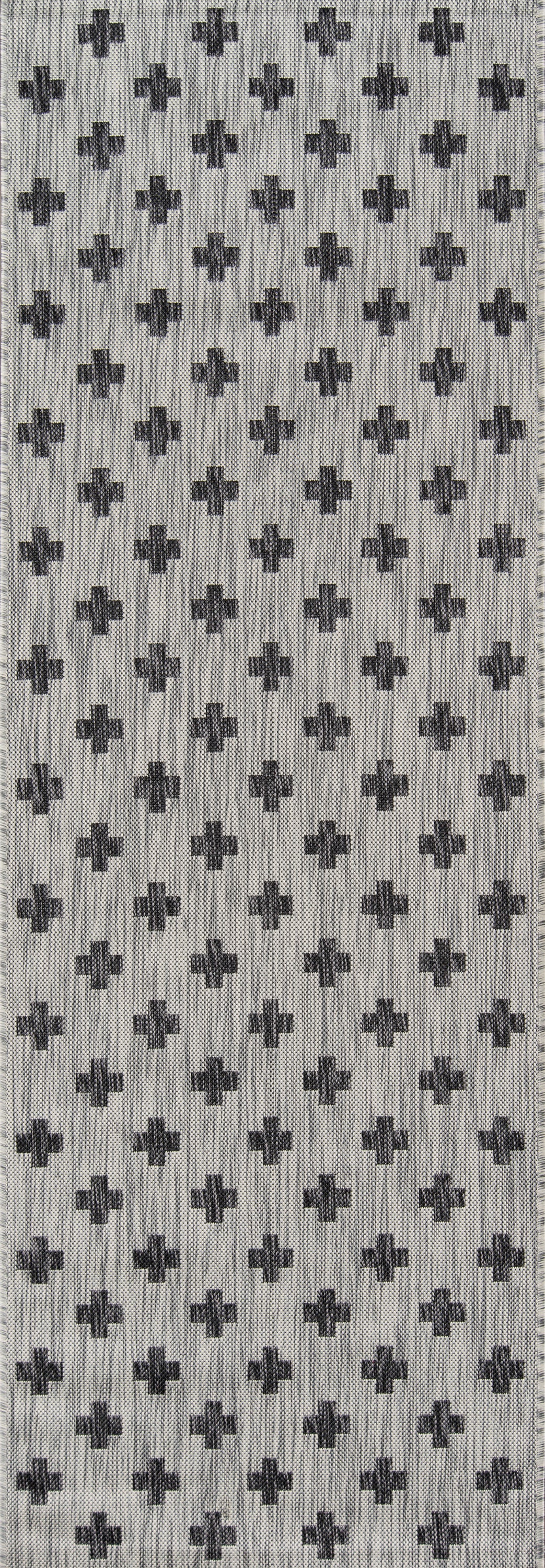 Grey woven rug with repeating dark cross motifs; geometric pattern, 3' x 5'.