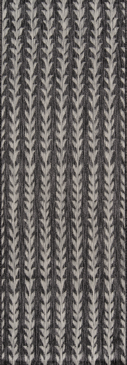 Charcoal and off-white woven rug runner with a vertical chevron/leaf pattern; textured textile.