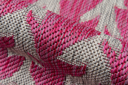 Close-up of pink & beige woven rug runner (2' x 6') with a jacquard pattern.