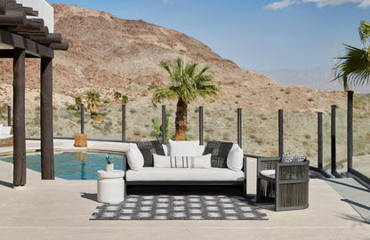 Black-and-white outdoor runner rug, 2' x 6', poolside.