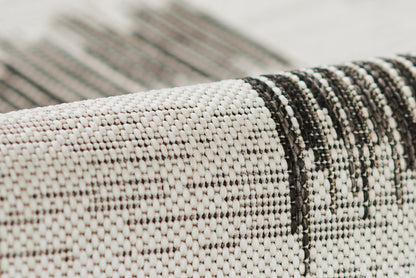 Ivory and black woven runner with a chunky textured weave and subtle geometric stripes.