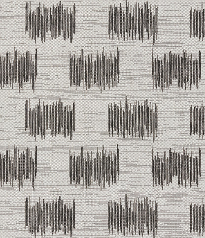 Beige woven rug with repeating charcoal waveform blocks in a gridded geometric pattern.