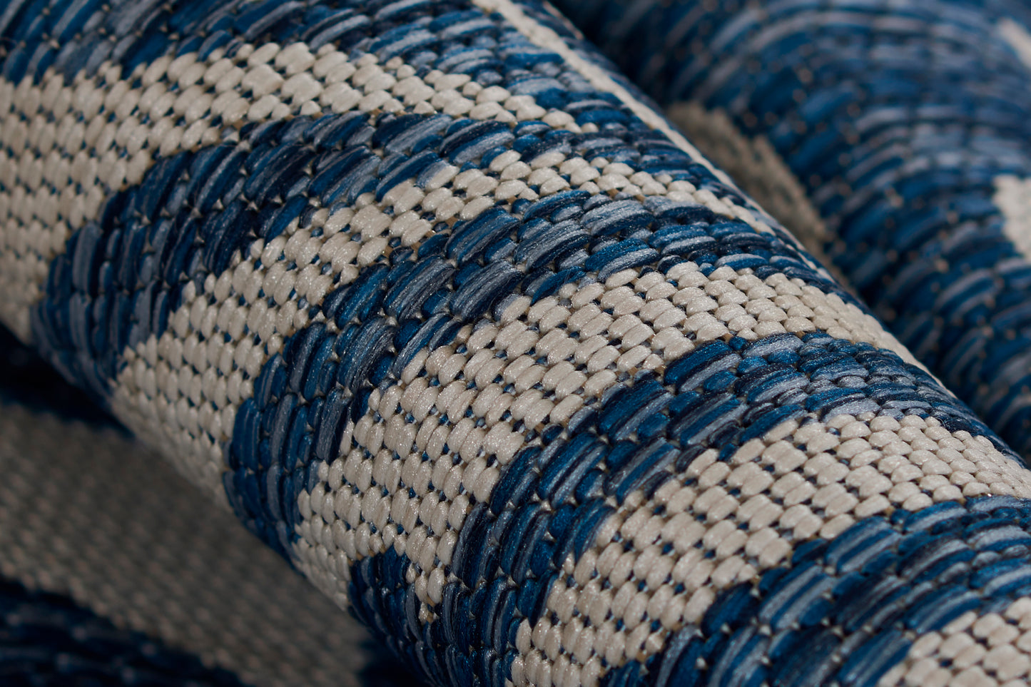 Blue and cream braided rope-textured fabric with a thick striped weave.