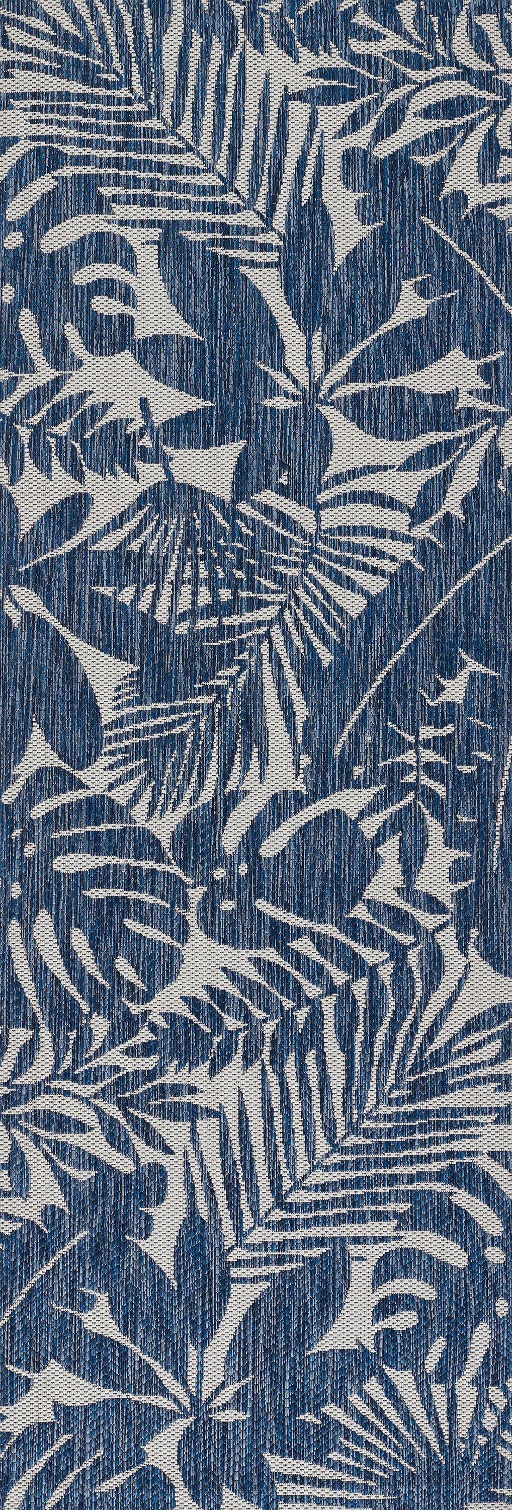 Blue textured fabric with white tropical palm and fern leaf pattern; versatile botanical print.
