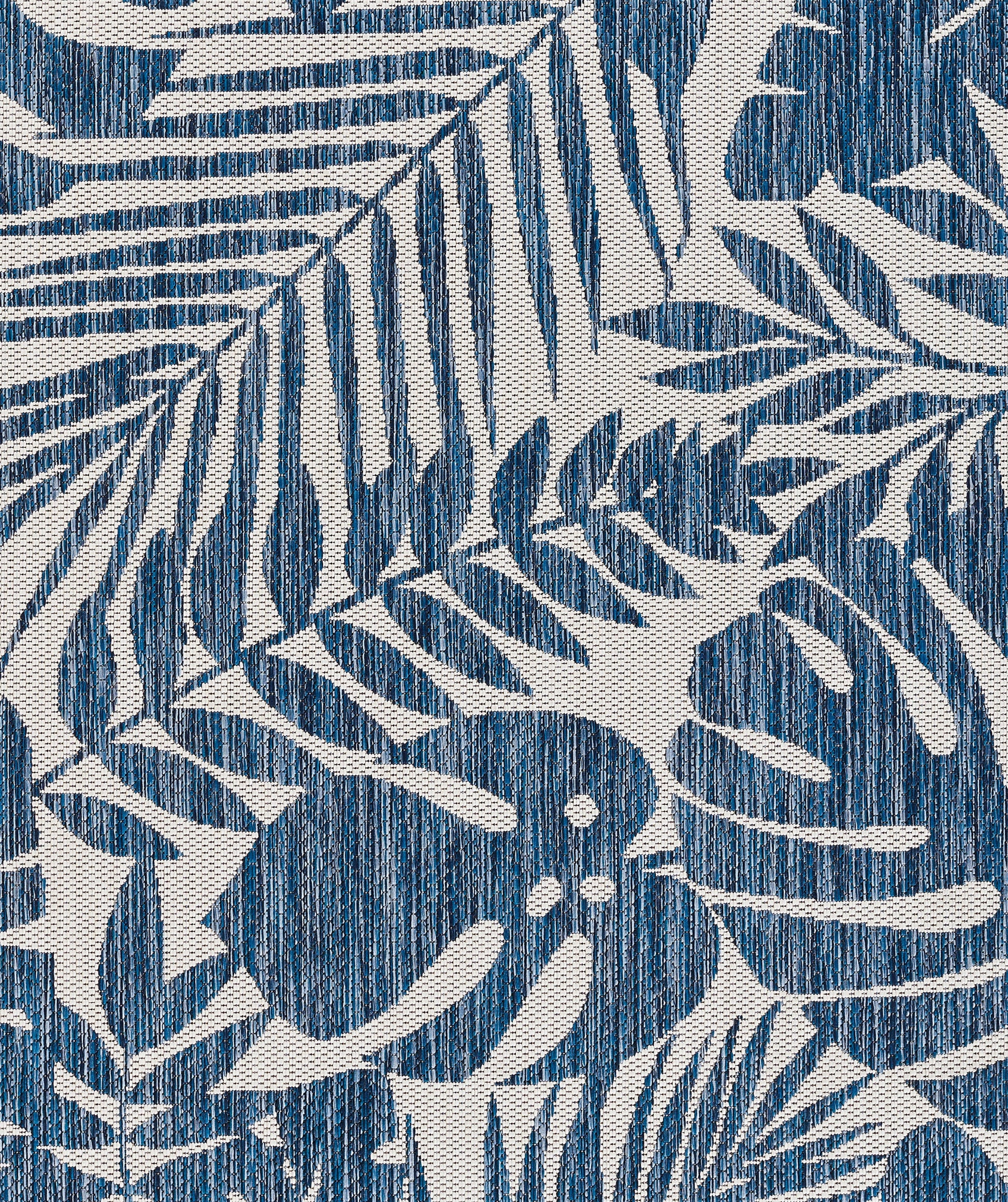 Blue palm leaf print rug runner with linen-textured cream background; tropical, summery.