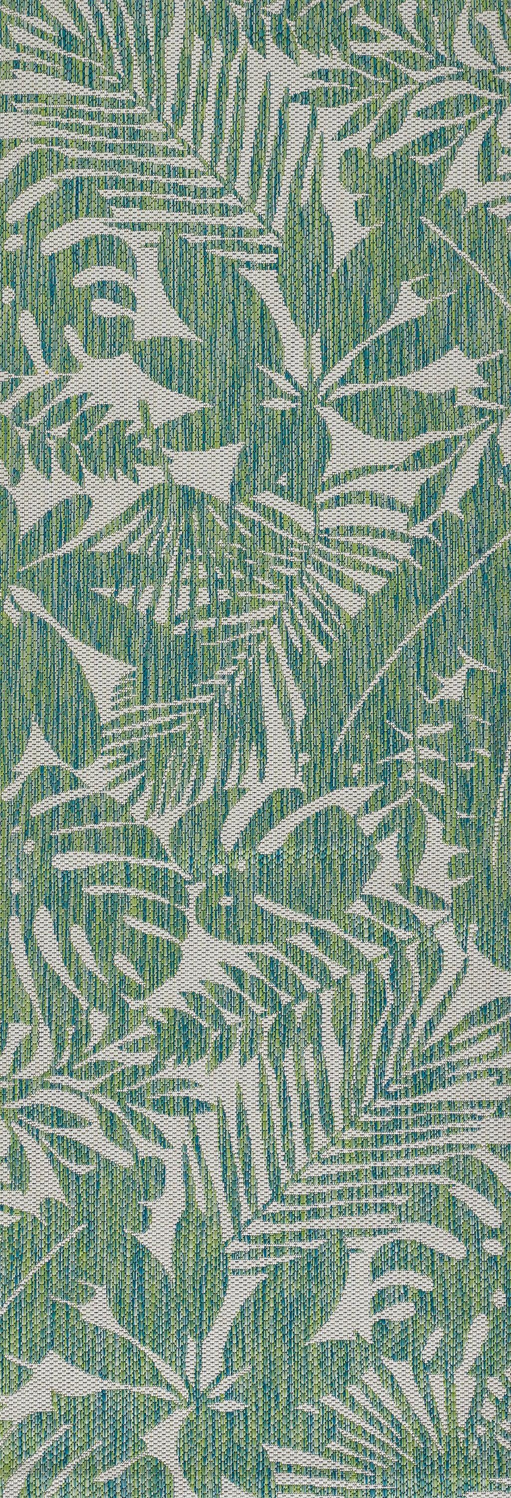 Green rug runner with a white palm-leaf botanical print.