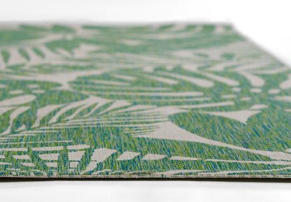 Green and white botanical pattern woven rug, rectangular decorative floor mat, tropical style.