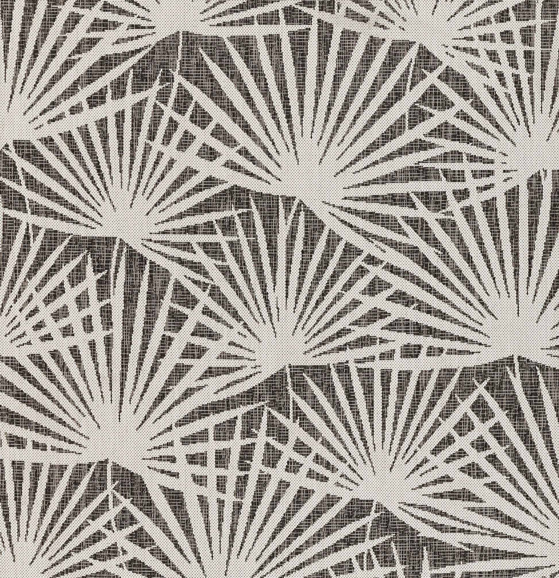 Cream sunburst fan pattern on dark brown rug; linen-like texture with bold geometric design.
