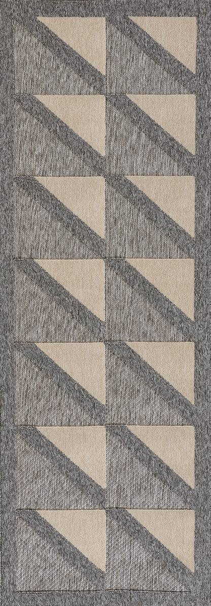 Gray woven rug with beige diagonal triangles in a vertical repeating geometric pattern.