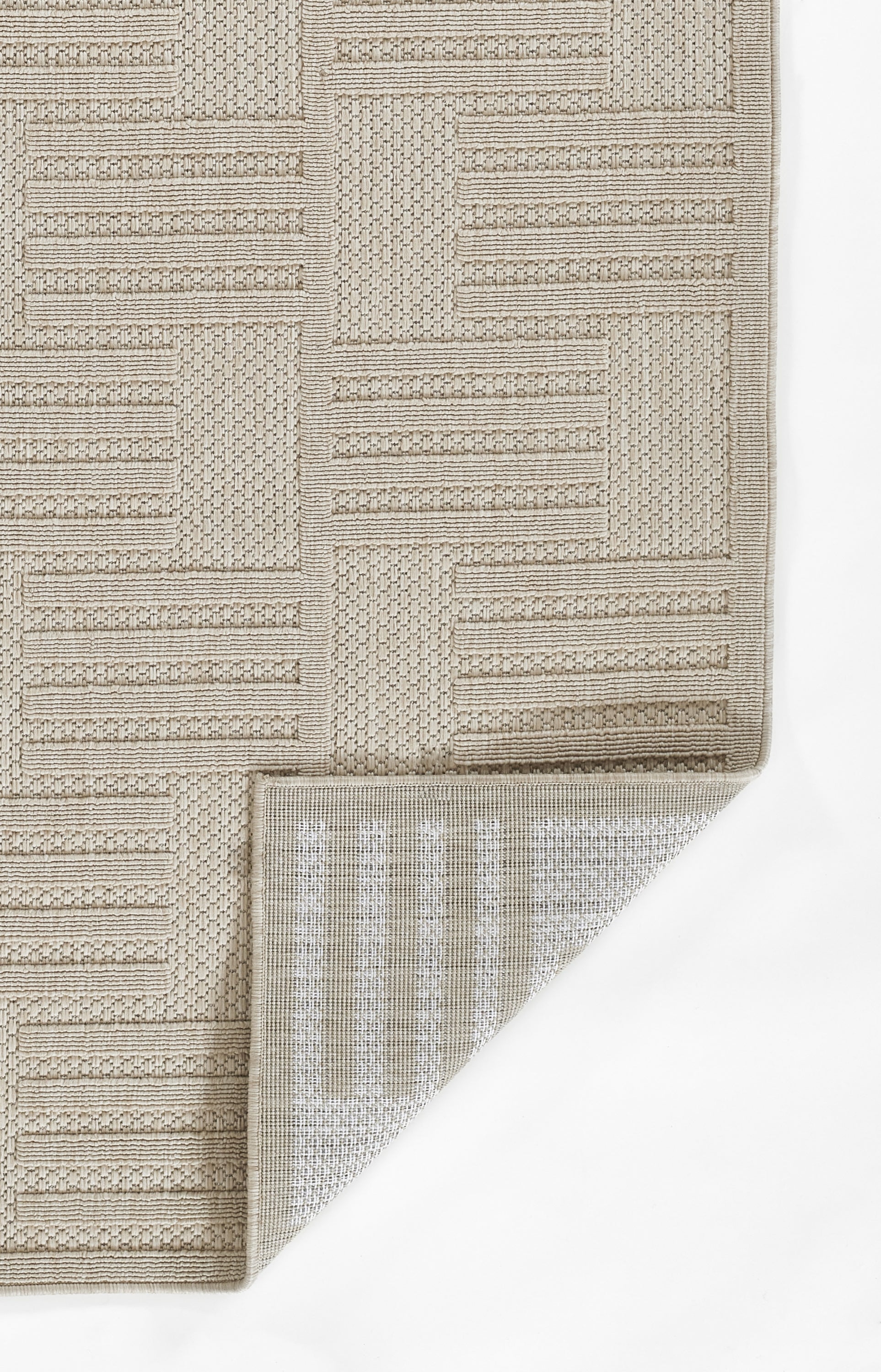 Beige woven area rug (9' x 13') with geometric block and stripe patterns; textured, neutral style with folded corner.