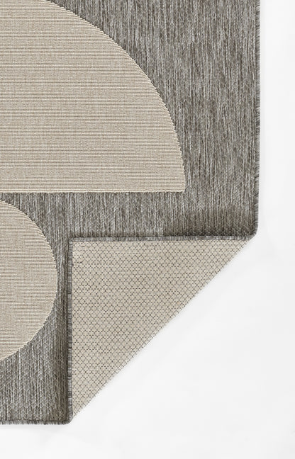 Gray geometric runner rug with beige circular and semi-circular shapes; corner-cut design.
