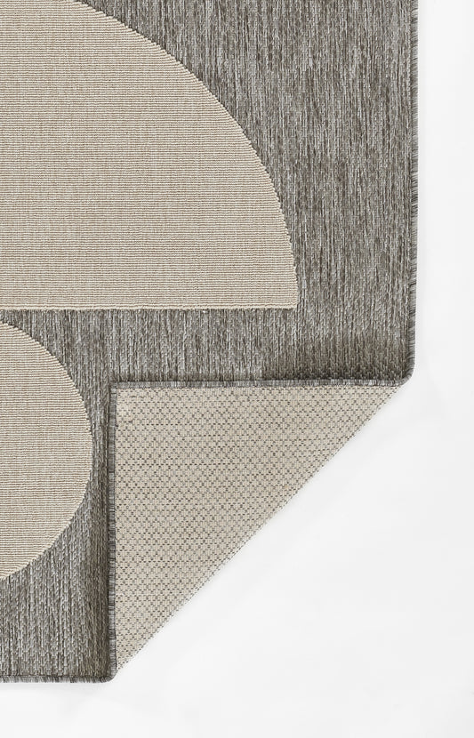 Gray geometric runner rug with beige circular and semi-circular shapes; corner-cut design.