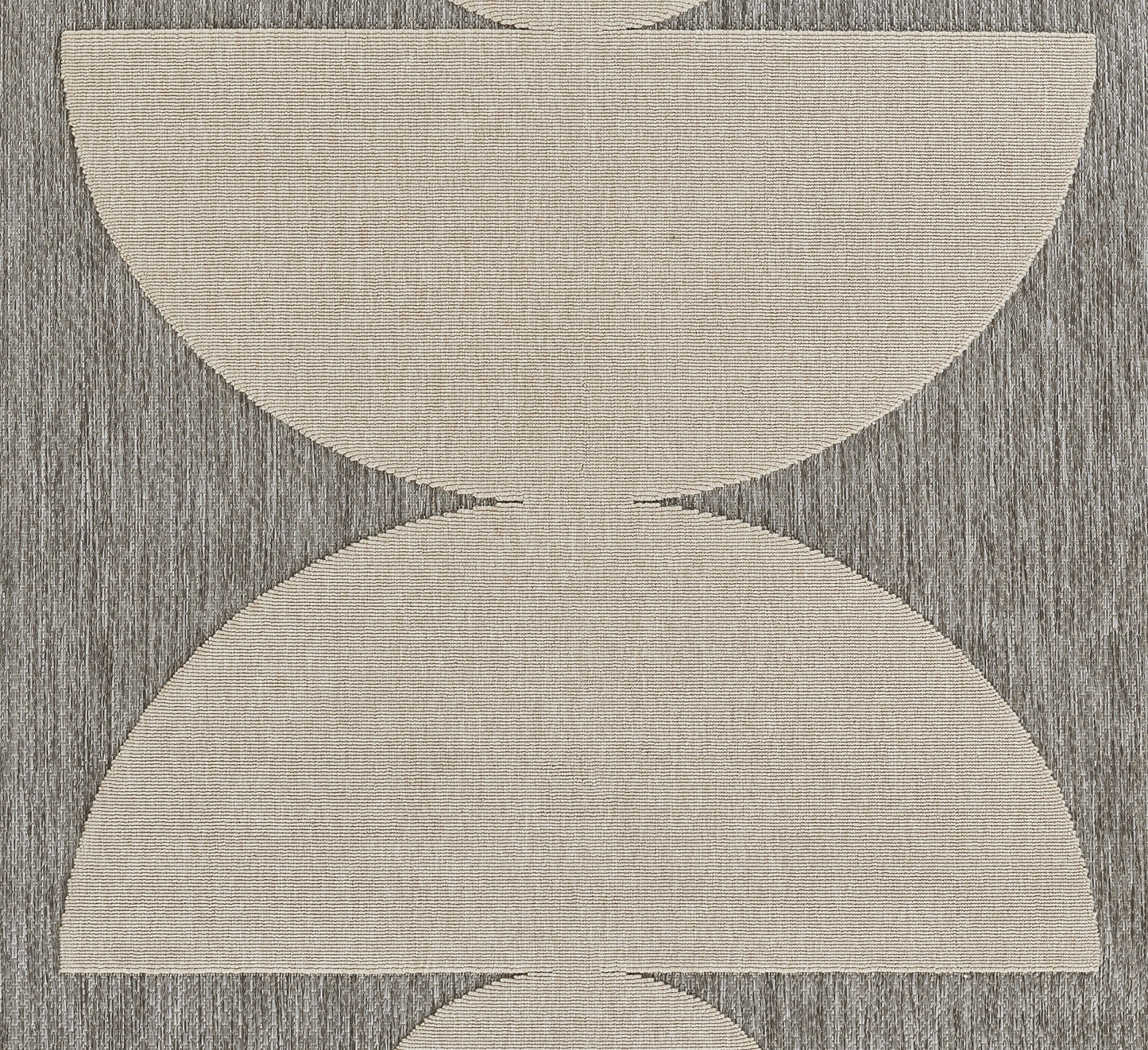 Gray textured rug with oversized cream-beige semicircular arcs forming an hourglass geometric pattern.
