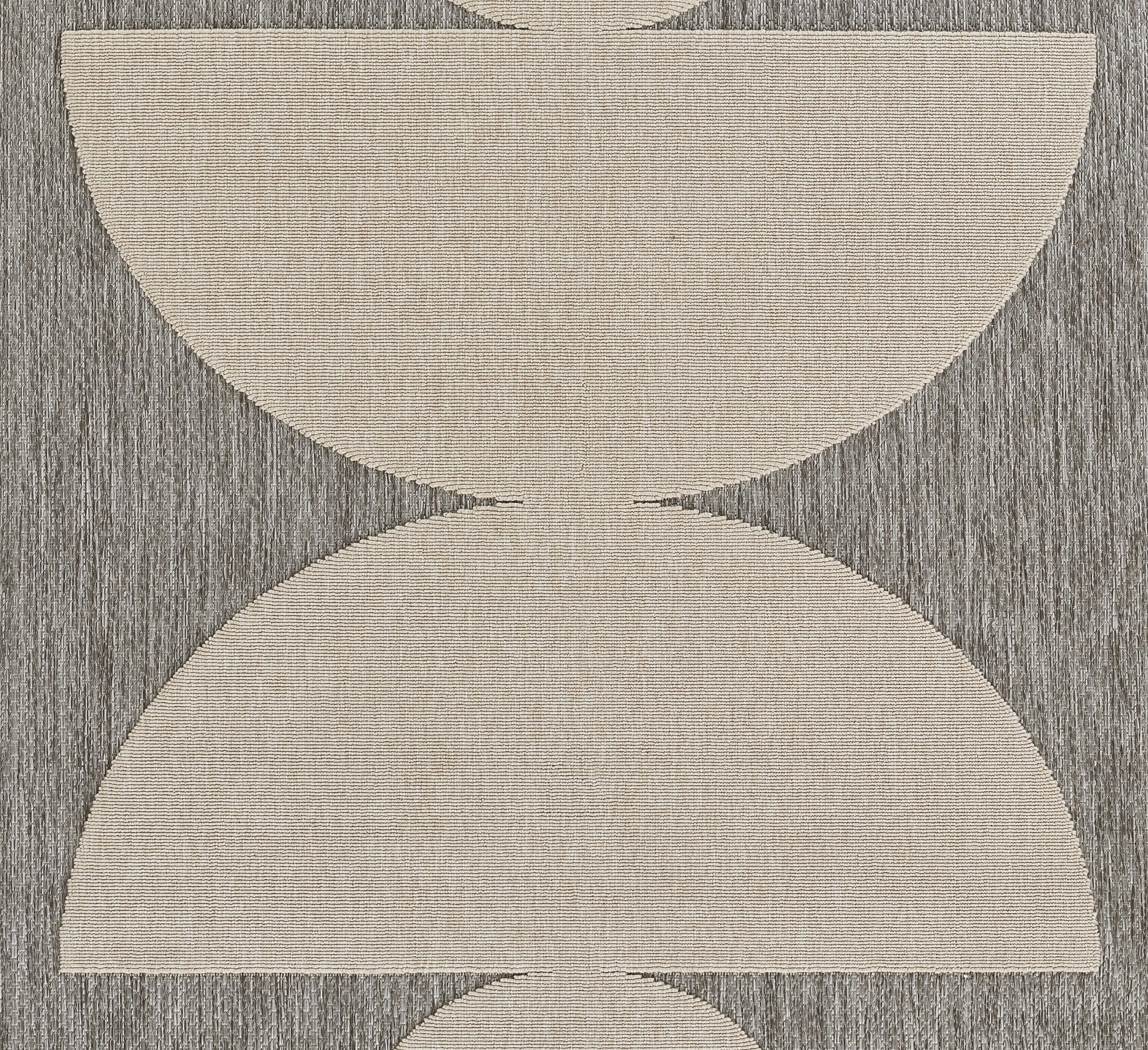 Gray textured rug with oversized cream-beige semicircular arcs forming an hourglass geometric pattern.