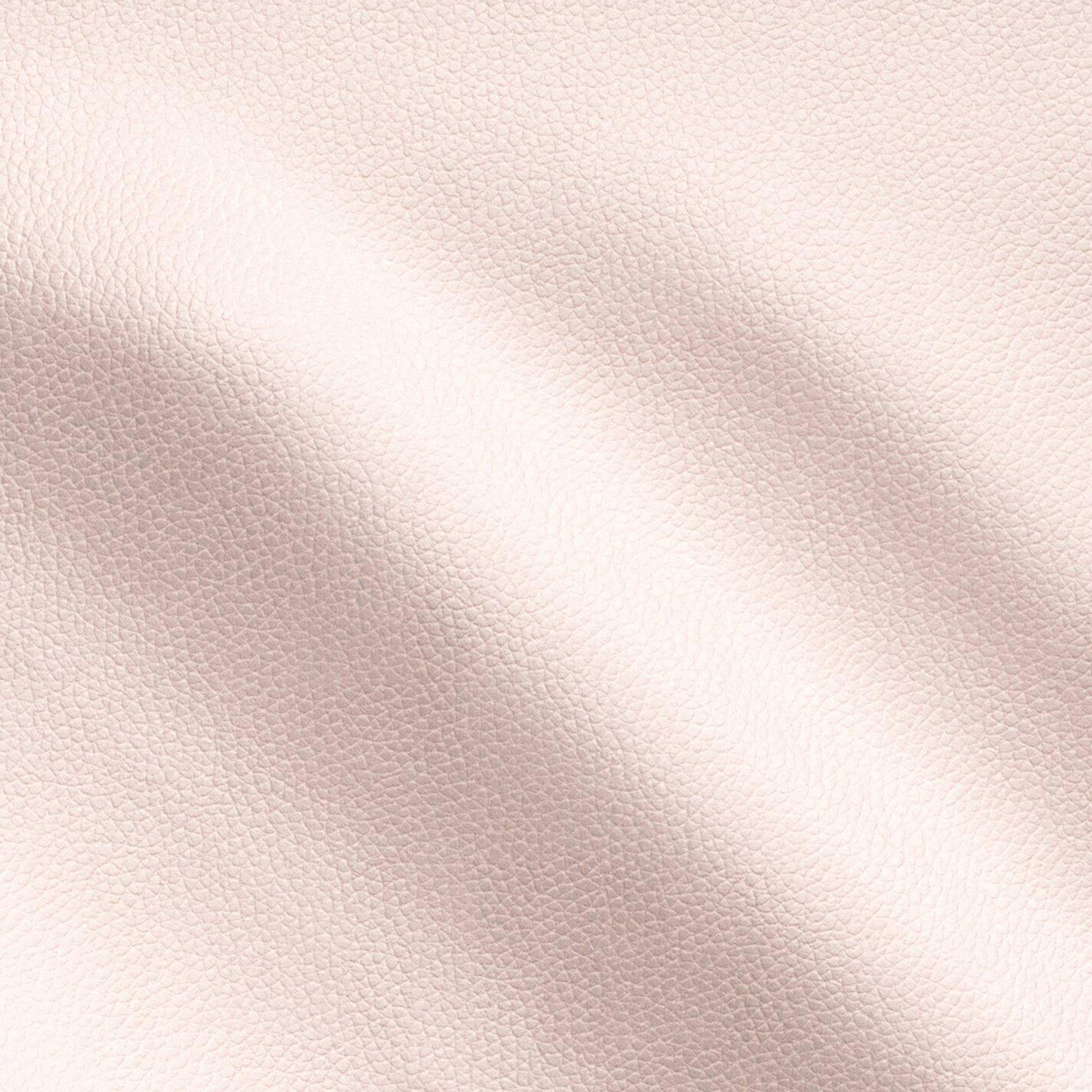 Blush-pink pebbled vegan leather texture with soft folds and subtle sheen.