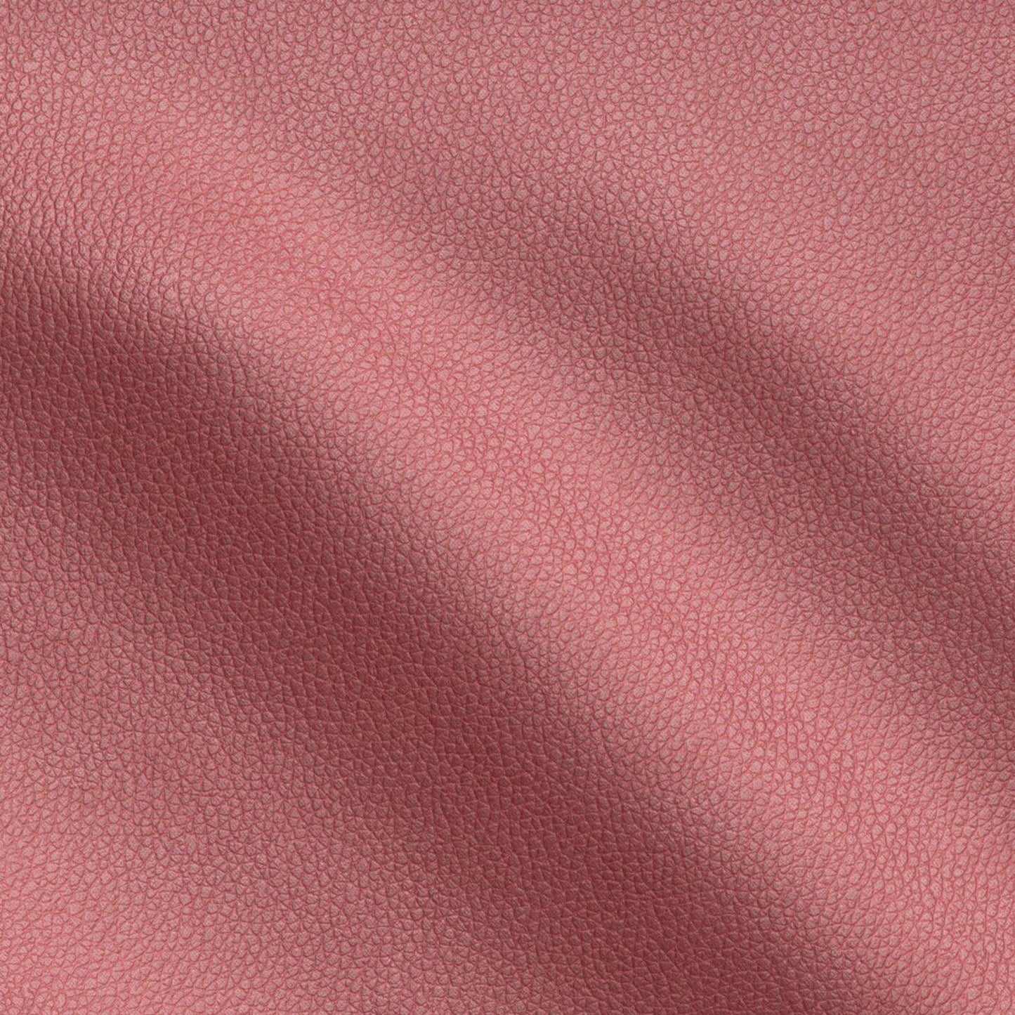 Close-up of red vegan leather with a pebbled texture and soft folds.