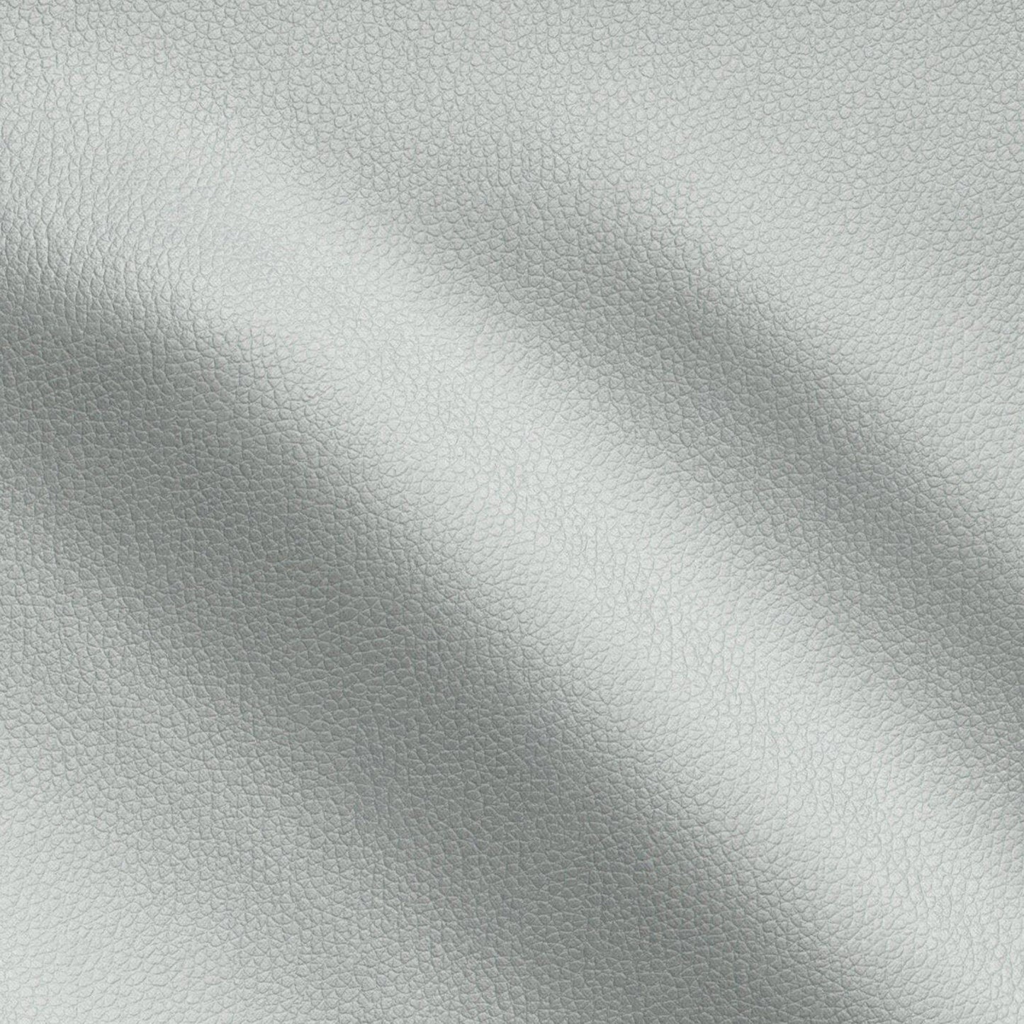Close-up of light gray pebbled vegan leather with soft folds, a textured material for bags or upholstery.