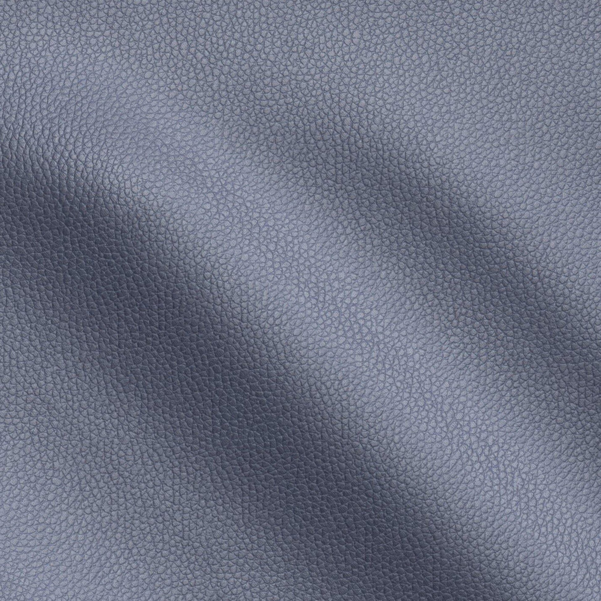 Navy blue pebbled fabric with a leather-like texture, showing gentle creases and soft shading.