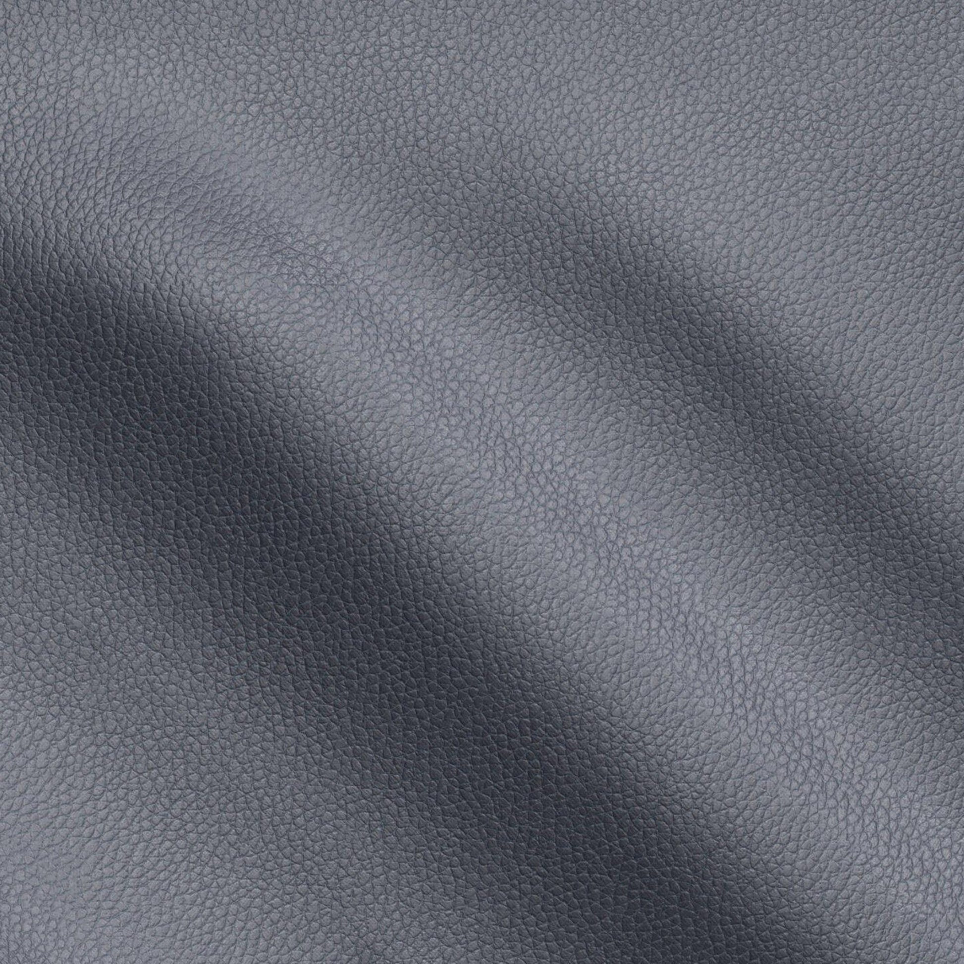 Navy blue pebbled vegan leather fabric with soft folds and subtle sheen.