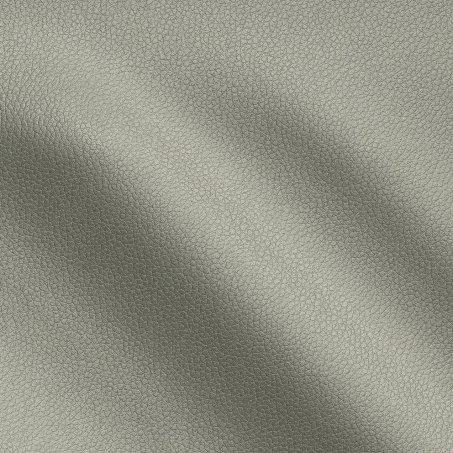 Green pebbled vegan leather vinyl fabric texture close-up with soft folds.