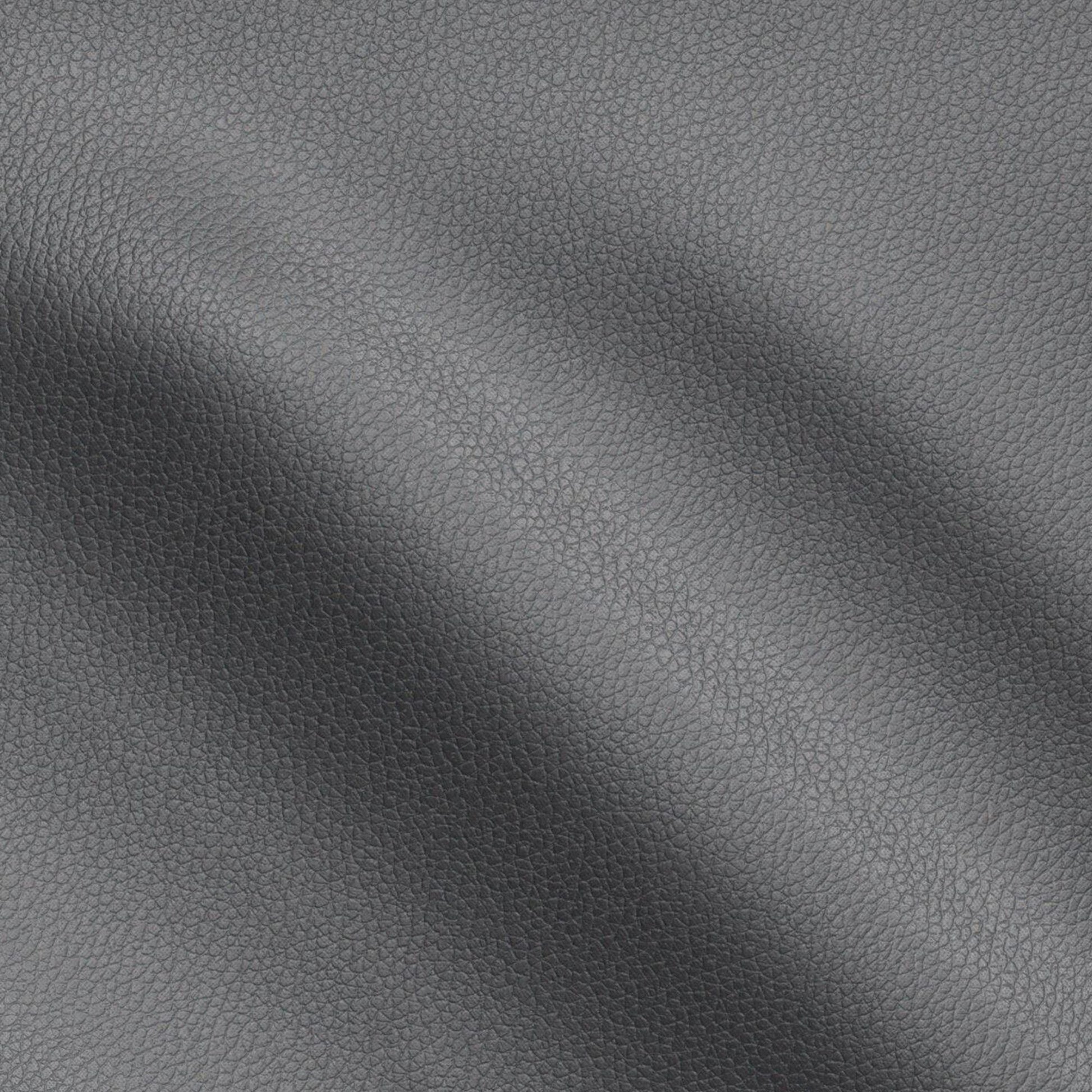 Black pebbled vegan leather texture with soft creases and subtle shading.