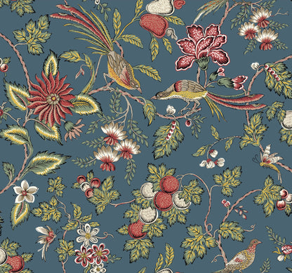 Blue wallpaper with a Jacobean-style botanical pattern featuring birds, red flowers, white blossoms and green foliage.