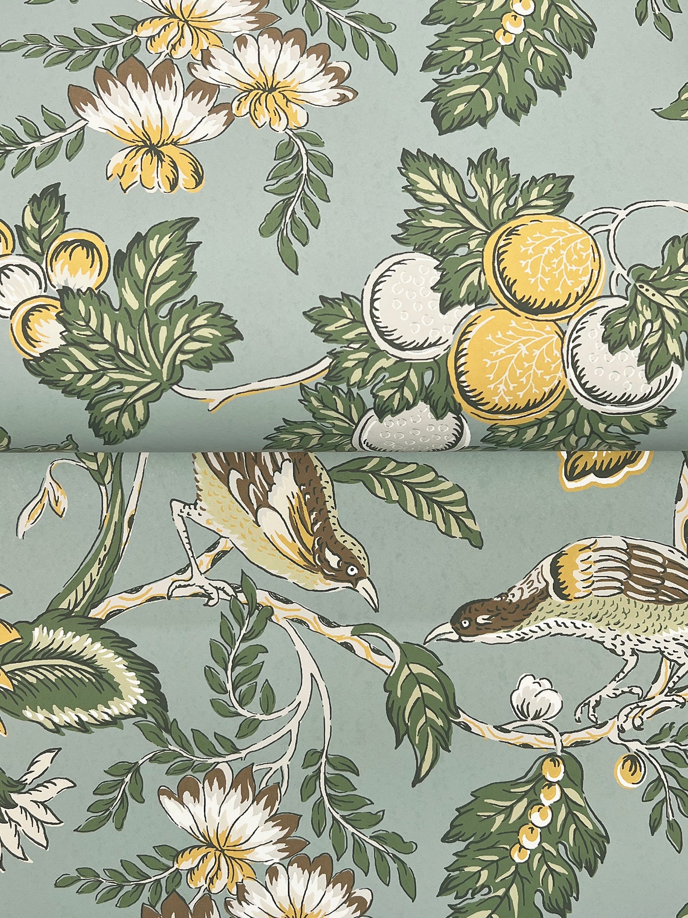Vintage botanical fabric with lemons, white/yellow flowers, green leaves, and small birds on a sage blue background.