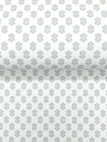 Pastel blue-gray quatrefoil floral pattern on white wallpaper, repeating grid.