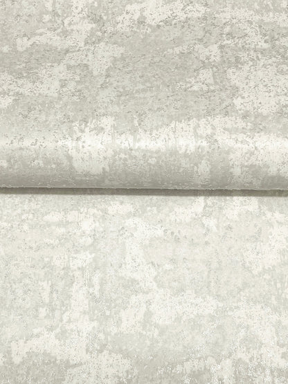 Light gray beaded wallpaper with a mottled texture and a subtle horizontal seam, featuring a dove motif.