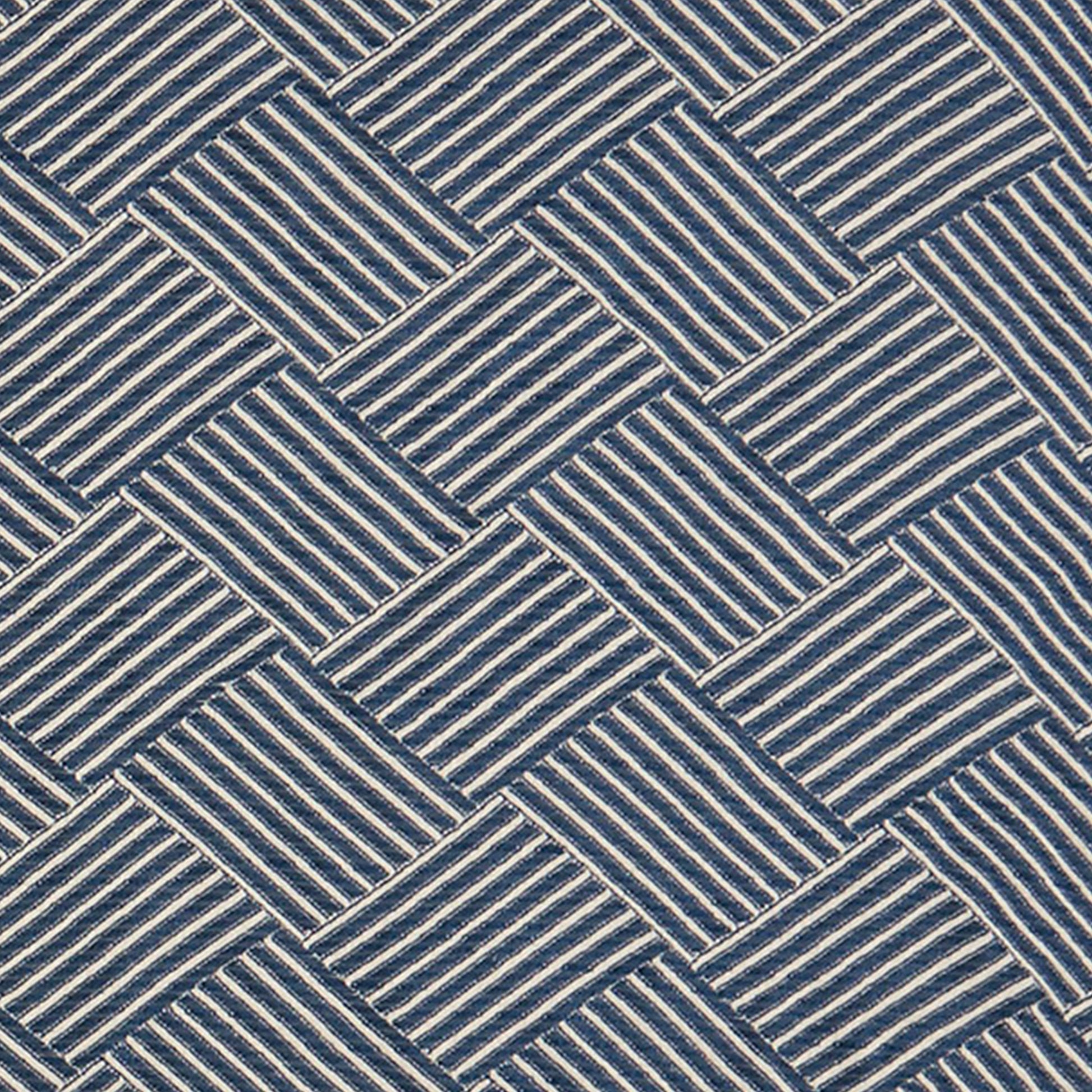 Navy blue and white geometric jacquard fabric with a woven basket-weave texture.