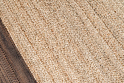 Natural beige woven jute rug runner with dark wood border, rustic coastal style.