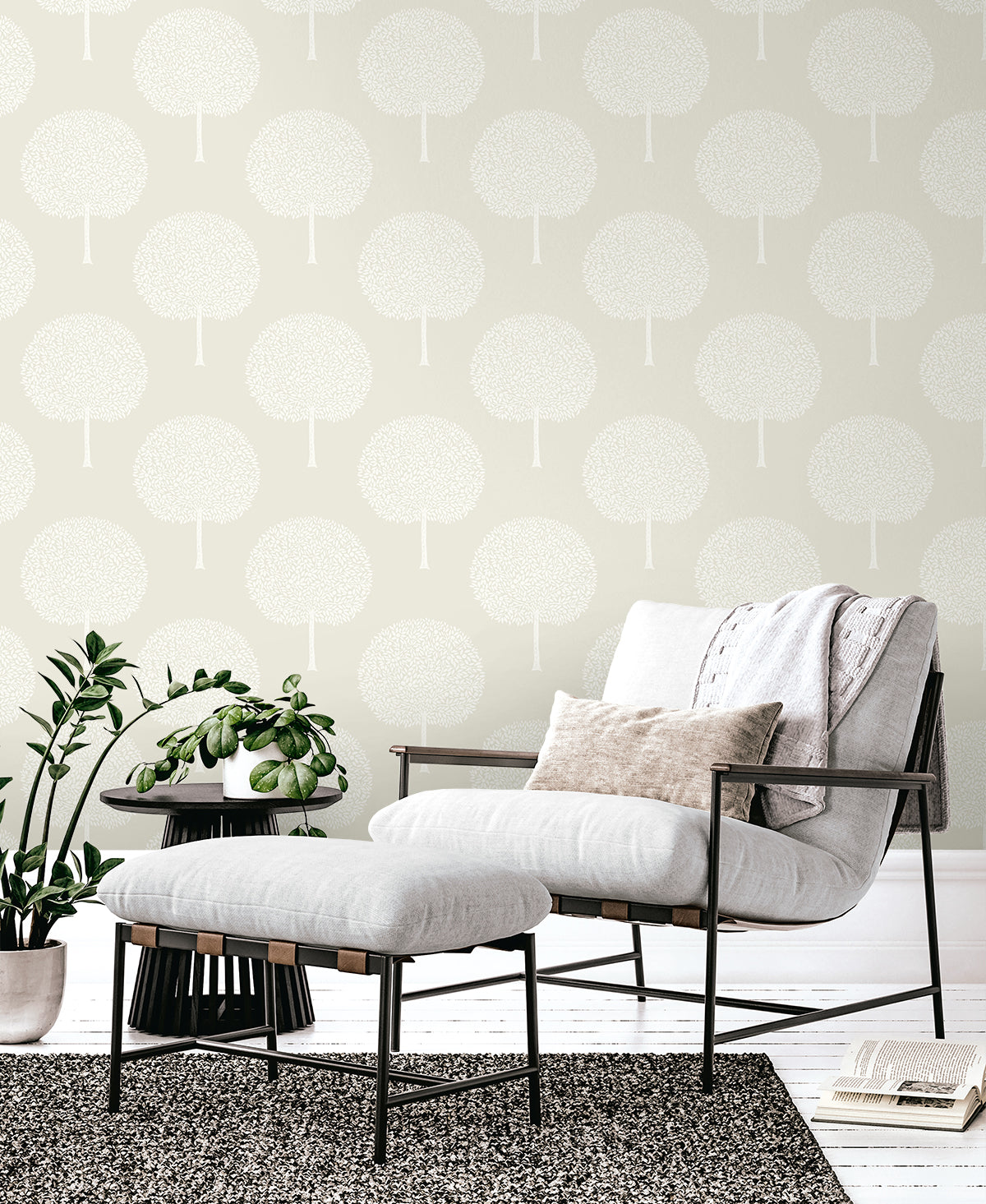 Pale gray wallpaper with a botanical tree-pattern design on the wall; interior scene.
