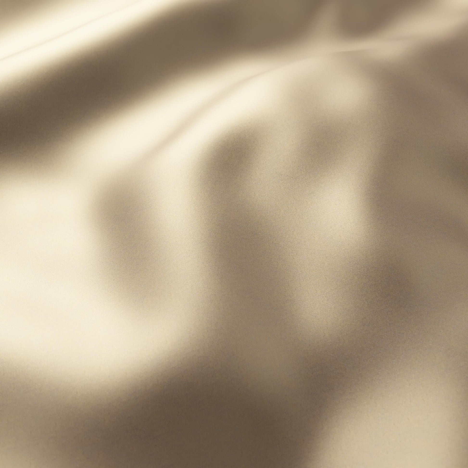 Plain brass sateen fabric with soft folds and subtle sheen; luxurious drape for gowns or linings.