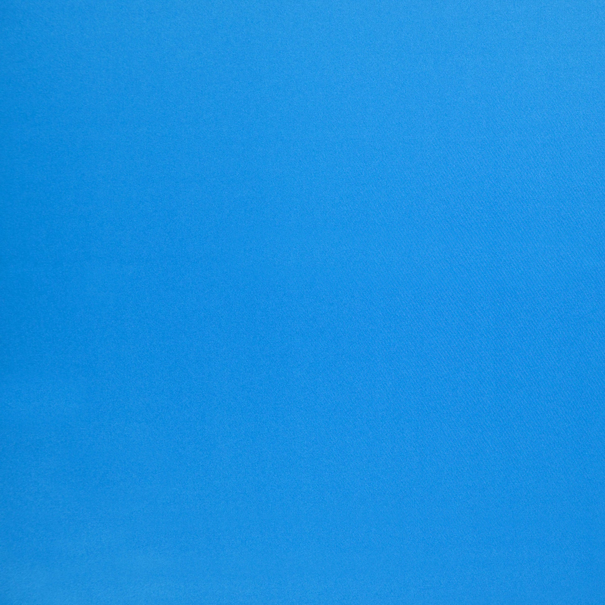 Solid royal blue fabric with subtle weave texture, smooth and versatile for clothing or home textiles.