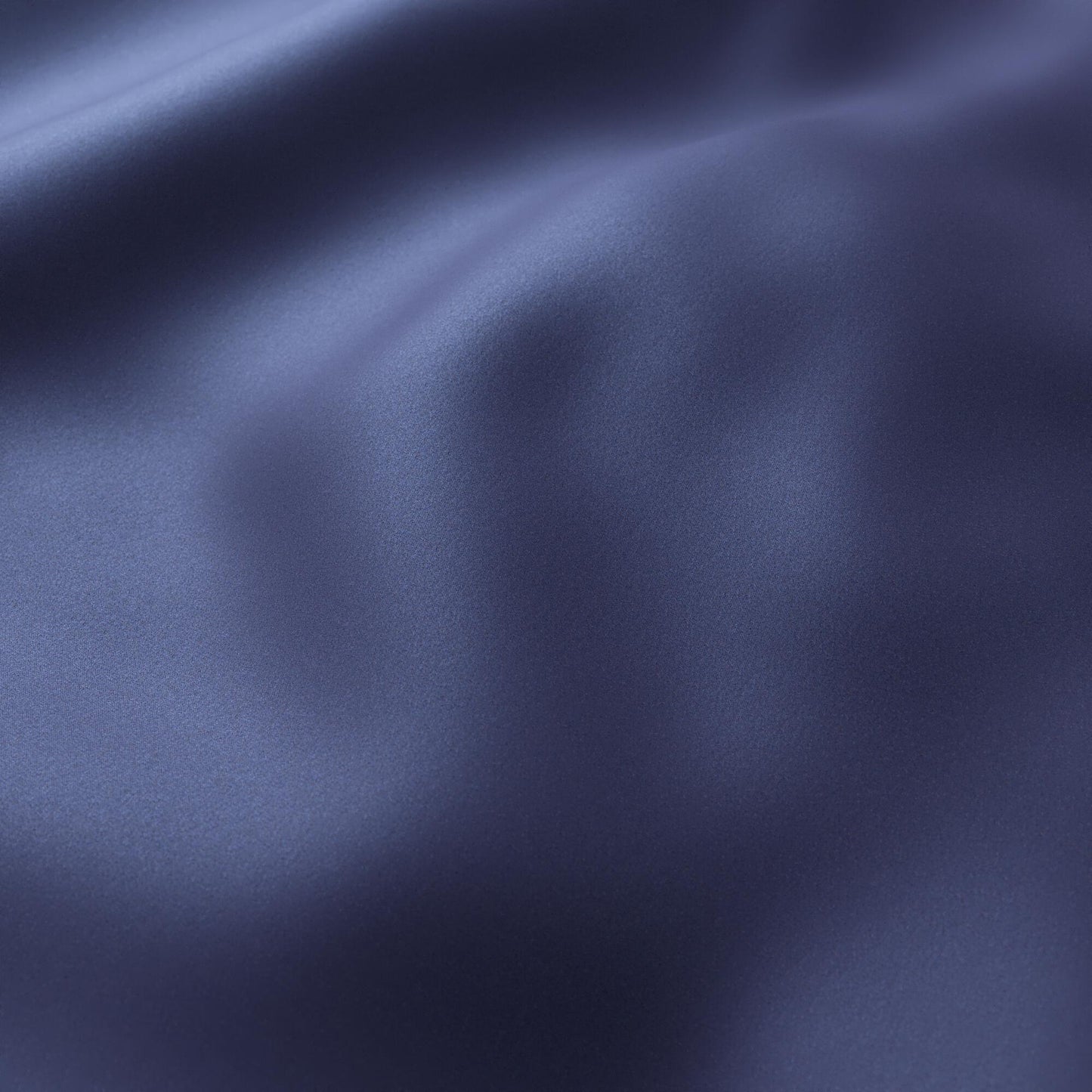 Navy blue sateen fabric with soft folds and subtle sheen.