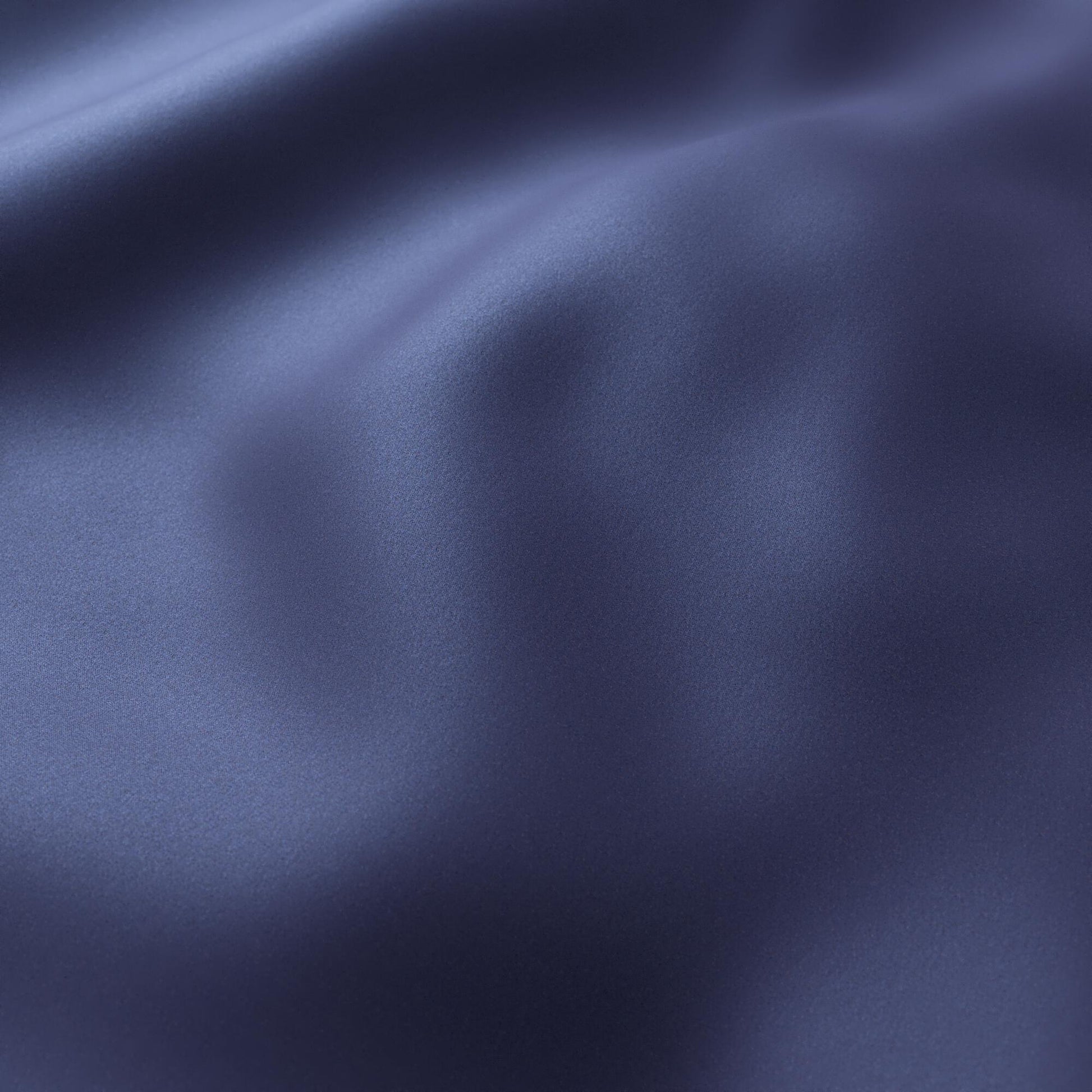 Navy blue sateen fabric with soft folds and subtle sheen.