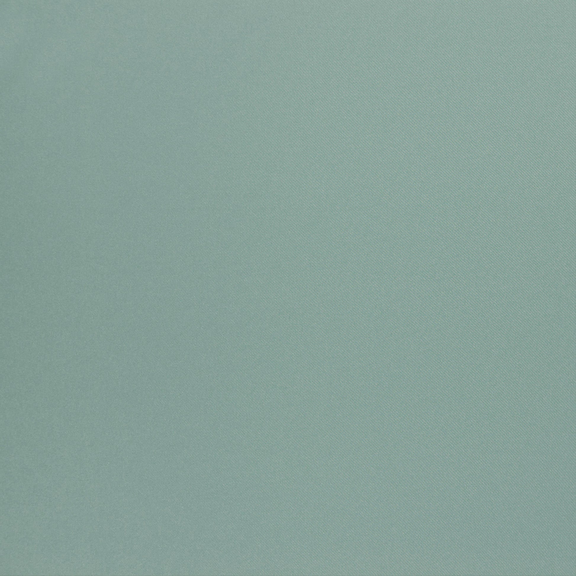 Green sateen fabric close-up with a subtle diagonal weave texture.
