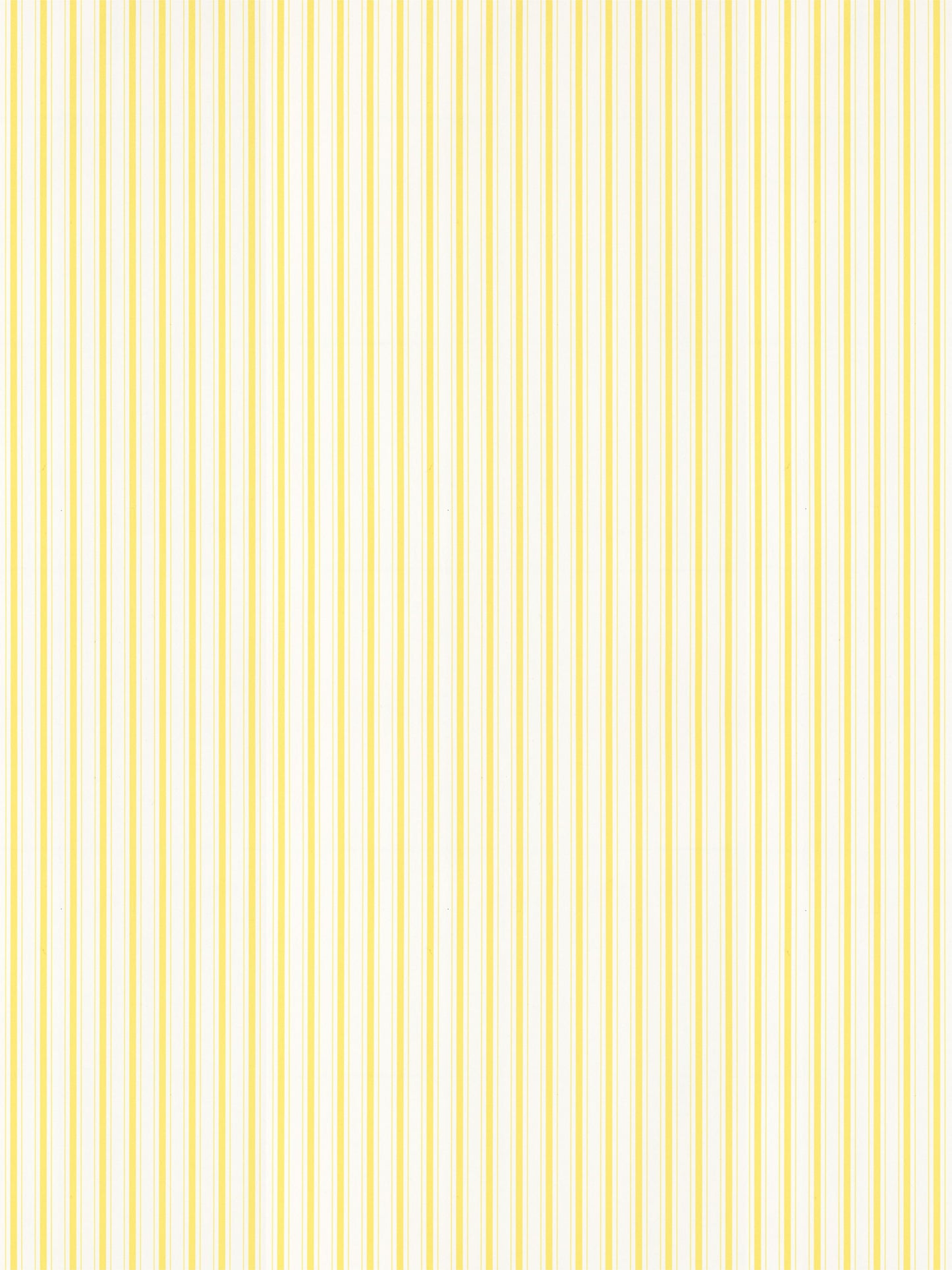 Yellow and white vertical stripe pattern on wallpaper; bright lemon stripe design.
