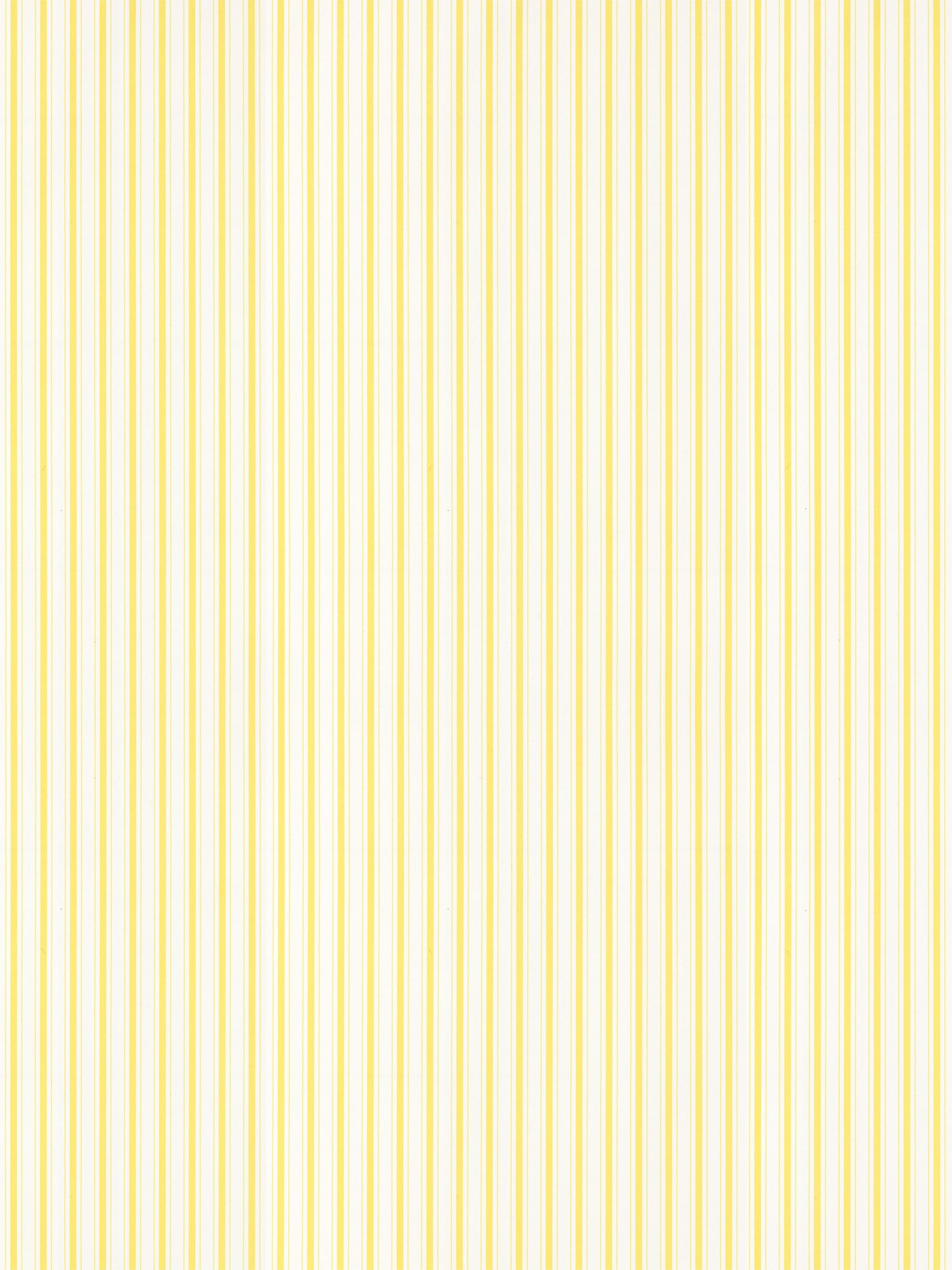 Yellow and white vertical stripe pattern on wallpaper; bright lemon stripe design.