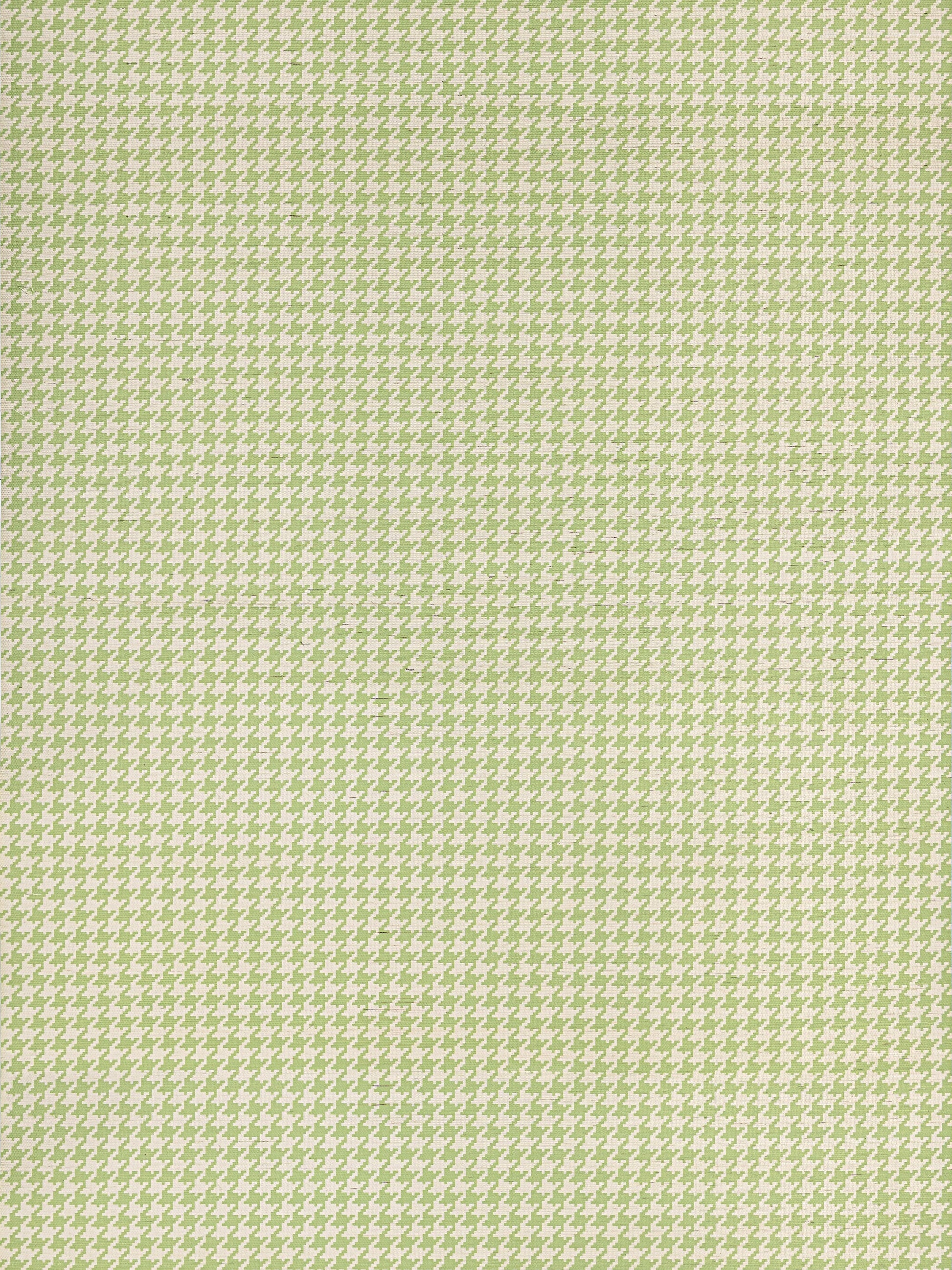 Green and white houndstooth fabric pattern; small repeating motif for clothing or home decor.